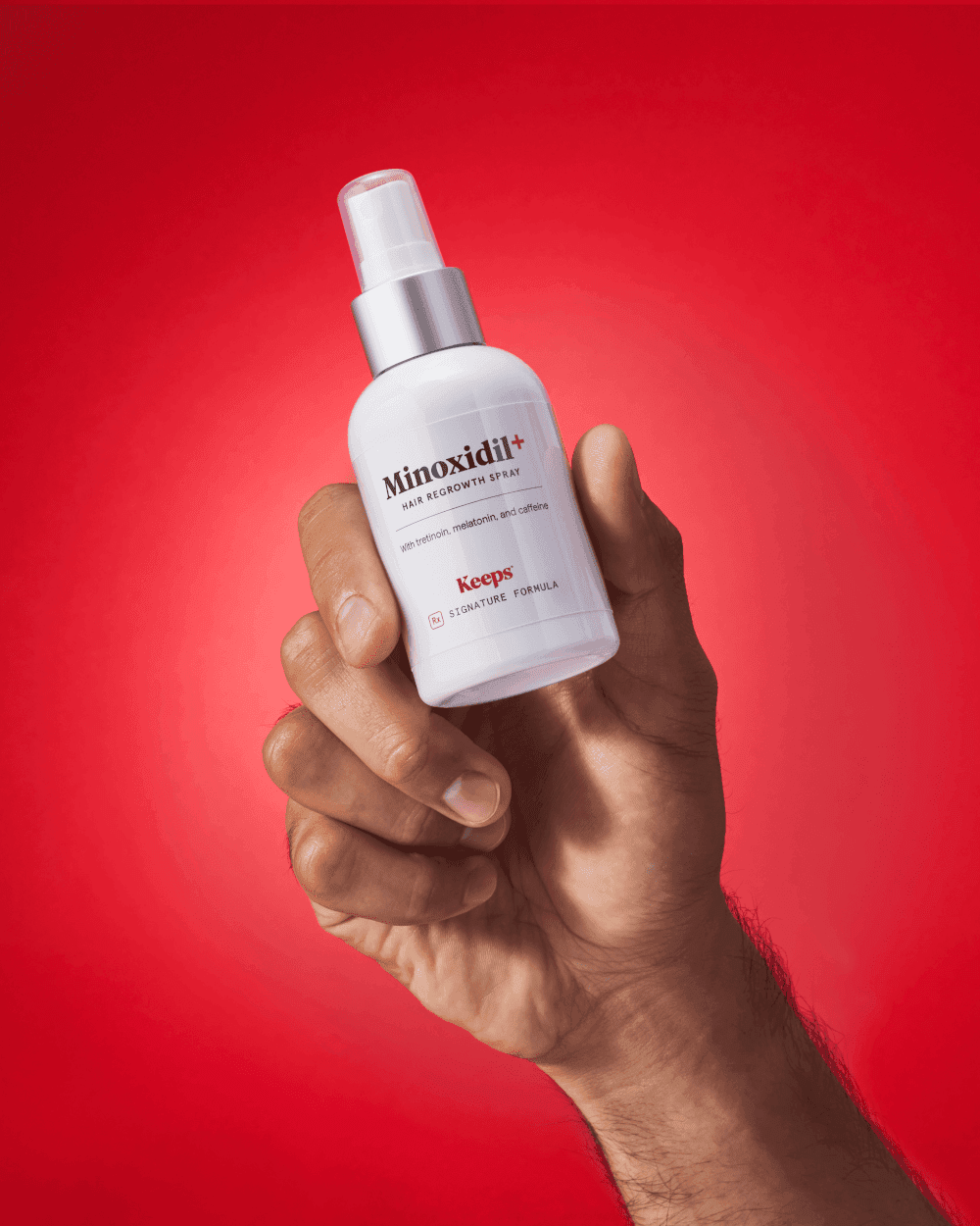 a bottle of keeps' minoxidil+ spray